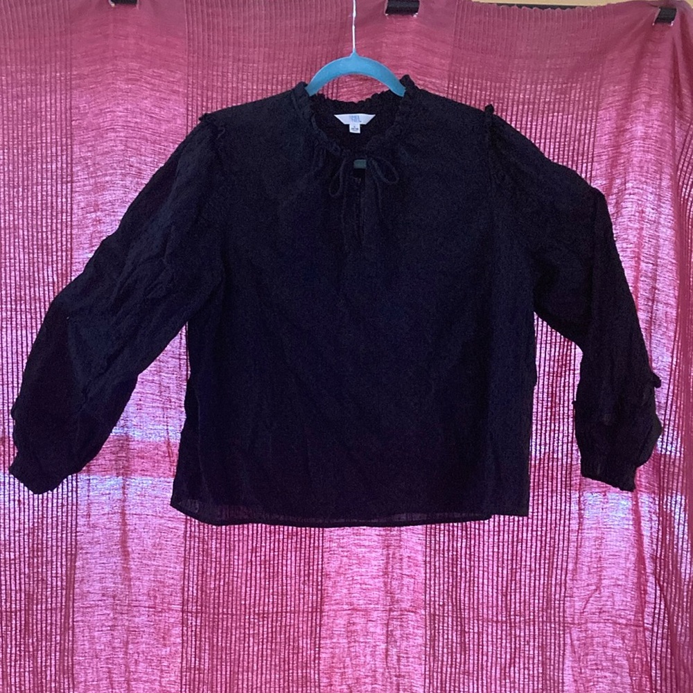 Large, black, loose-fitting blouse